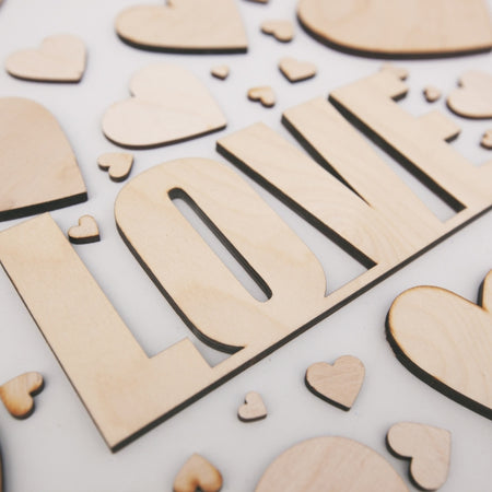 The word "Love" used in the creation of a Laser Cutting and Engraving project using Plyco's 3mm Birch Laserply