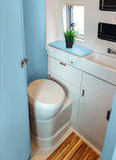 Bathroom in a RV / Caravan featuring 3mm Sky Vanply for interior caravan wall panels and cabinets from Melbourne plywood supplier Plyco without a white background