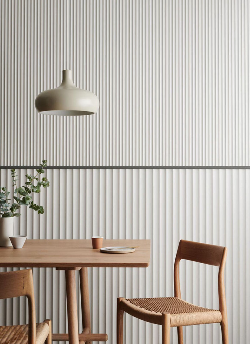 Project featuring Laminex Surround MDF wall panel Scallop 45 and Scallop 225 used in a dining area not on a white background. Available to buy online from plywood supplier Plyco.