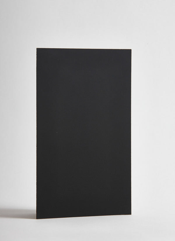 Plyco's raw 1mm Black Spotless Laminate on a white background