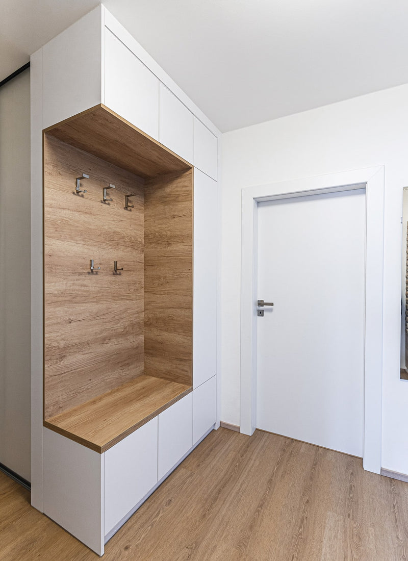Melbourne plywood supplier Plyco's 18mm White Standard Particleboard used as cabinetry for a contemporary home wardrobe with a white background
