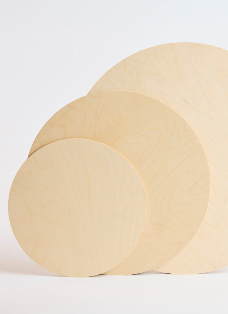 Three of Plyco's pre-cut 3mm Birch Laserply Circles in various sizes on a white background