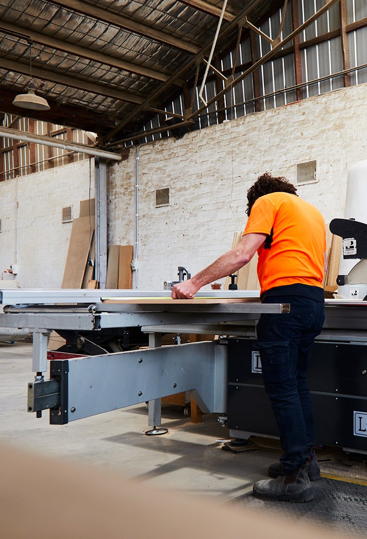 Panel saw operator cutting plywood to size in Melbourne