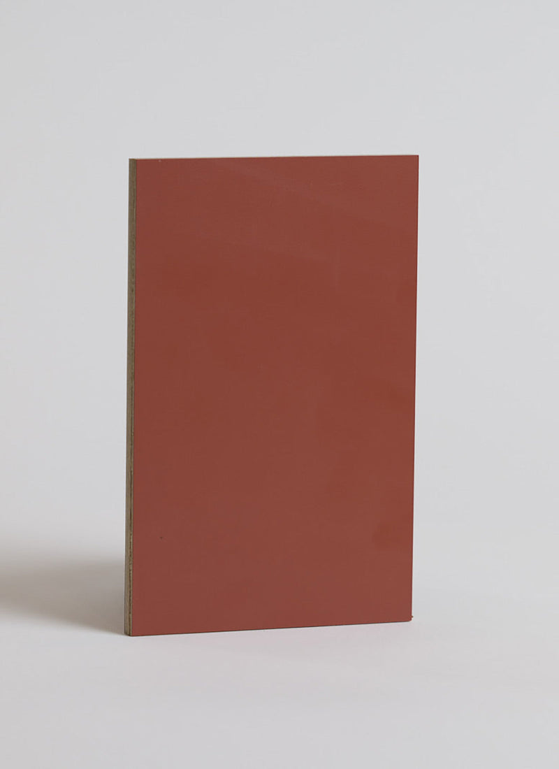 Plyco's 0.6mm Dark Orange Laminate on a white background