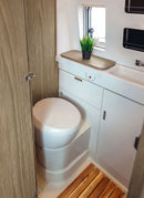 Bathroom in a RV / Caravan featuring 3mm  Alicante Oak Vanply for interior caravan wall panels and cabinets from Melbourne plywood supplier Plyco without a white background