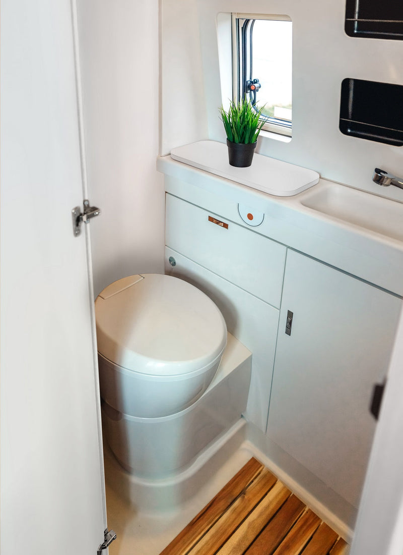 Bathroom in a RV / Caravan featuring 3mm Classic White Vanply for interior caravan wall panels and cabinets from Melbourne plywood supplier Plyco without a white background