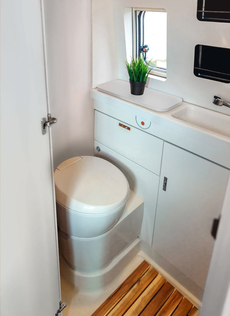 Bathroom in a RV / Caravan featuring 3mm Cloud Vanply for interior caravan wall panels and cabinets from Melbourne plywood supplier Plyco without a white background