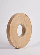 Plyco's 100m x 23mm x 1mm Unglued ABS Vanply Edging in Valencia Oak on a white background