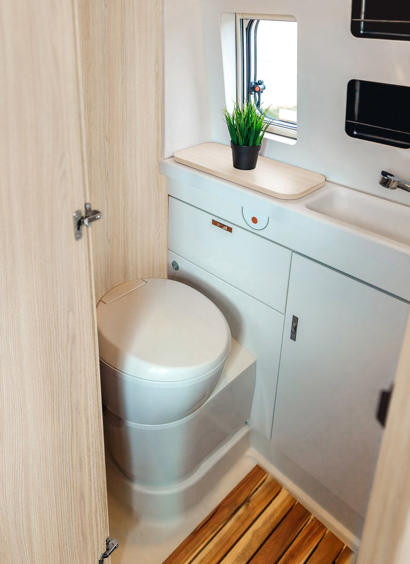 Bathroom in a RV / Caravan featuring 3mm Light Oak Vanply for interior caravan wall panels and cabinets from Melbourne plywood supplier Plyco without a white background