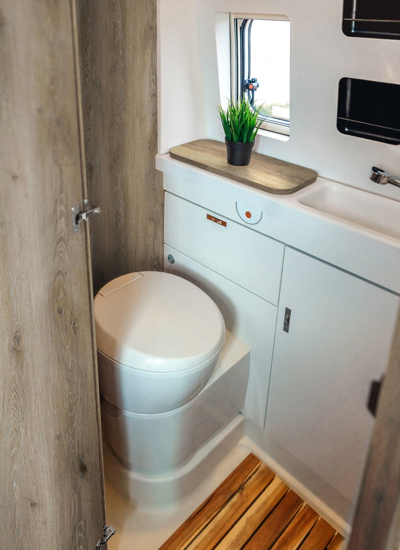 Bathroom in a RV / Caravan featuring 3mm Limewash Oak Vanply for interior caravan wall panels and cabinets from Melbourne plywood supplier Plyco without a white background