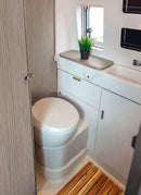 Bathroom in a RV / Caravan featuring 3mm  Malaga Elm Vanply for interior caravan wall panels and cabinets from Melbourne plywood supplier Plyco without a white background
