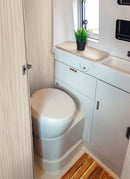 Bathroom in a RV / Caravan featuring 3mm  Morella Oak Vanply for interior caravan wall panels and cabinets from Melbourne plywood supplier Plyco without a white background
