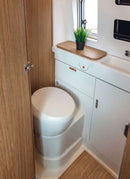 Bathroom in a RV / Caravan featuring 3mm  Pamplona Elm Vanply for interior caravan wall panels and cabinets from Melbourne plywood supplier Plyco without a white background