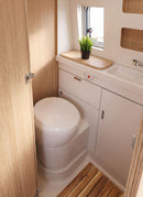 Bathroom in a RV / Caravan featuring 3mm  Ronda Elm Vanply for interior caravan wall panels and cabinets from Melbourne plywood supplier Plyco without a white background