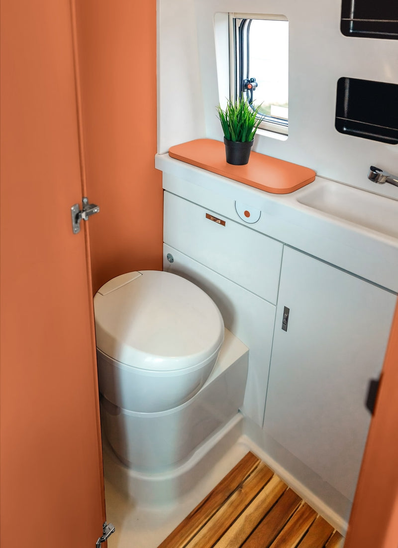 Bathroom in a RV / Caravan featuring 3mm Rust Vanply for interior caravan wall panels and cabinets from Melbourne plywood supplier Plyco without a white background
