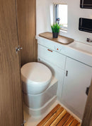 Bathroom in a RV / Caravan featuring 3mm  Seville Oak Vanply for interior caravan wall panels and cabinets from Melbourne plywood supplier Plyco without a white background