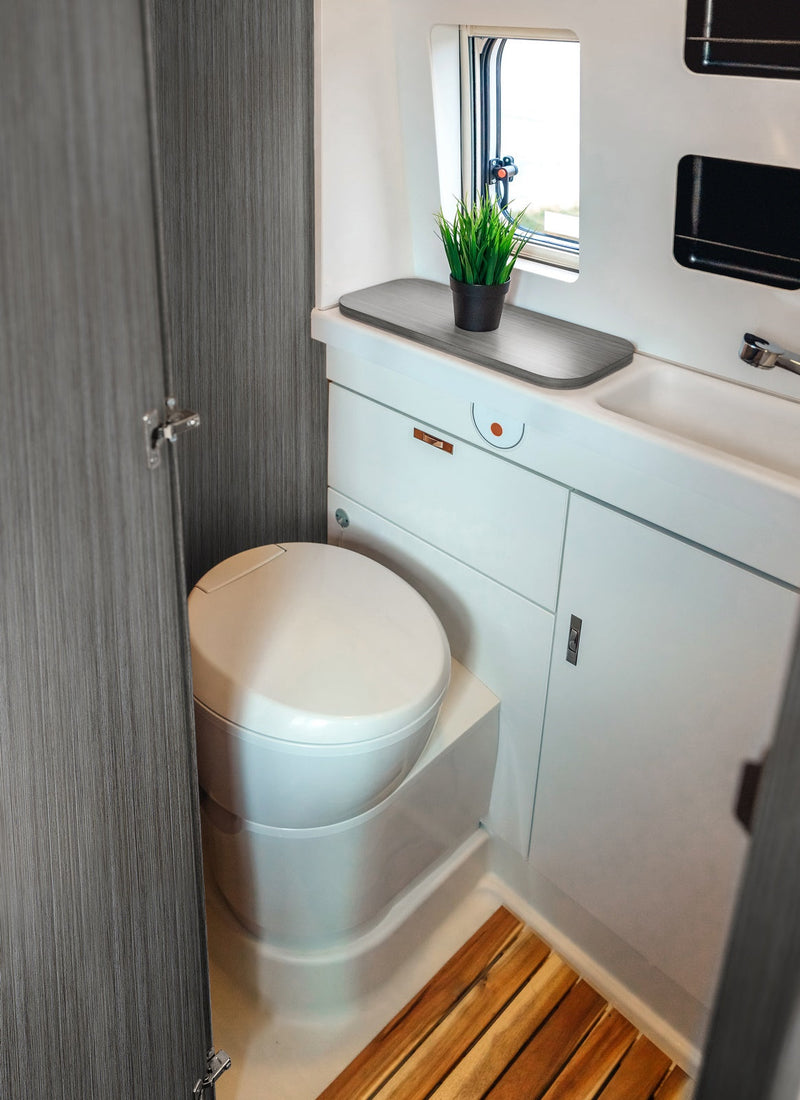 Bathroom in a RV / Caravan featuring 3mm Walnut Fineline Vanply for interior caravan wall panels and cabinets from Melbourne plywood supplier Plyco without a white background