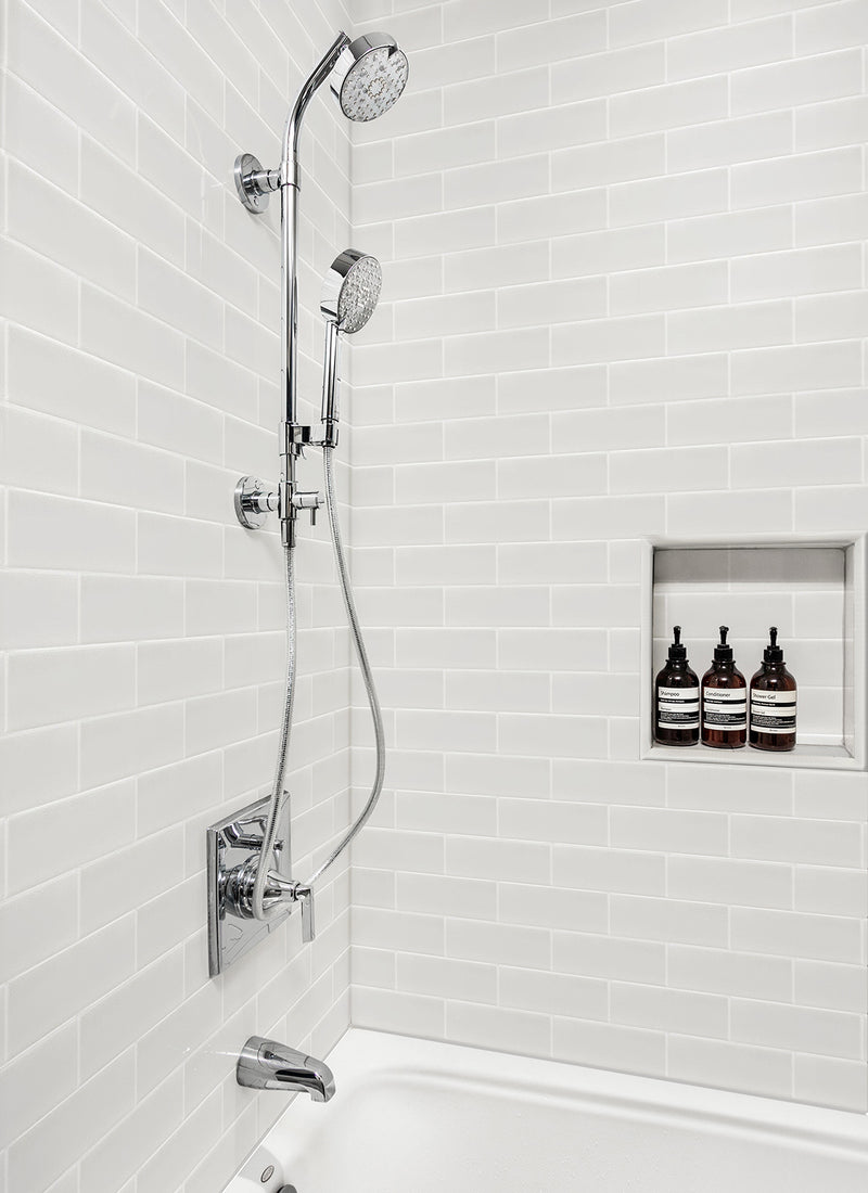 A residential shower featuring Forest One's New York White Tiled WallART Wet Area Panel from Plyco without a white background