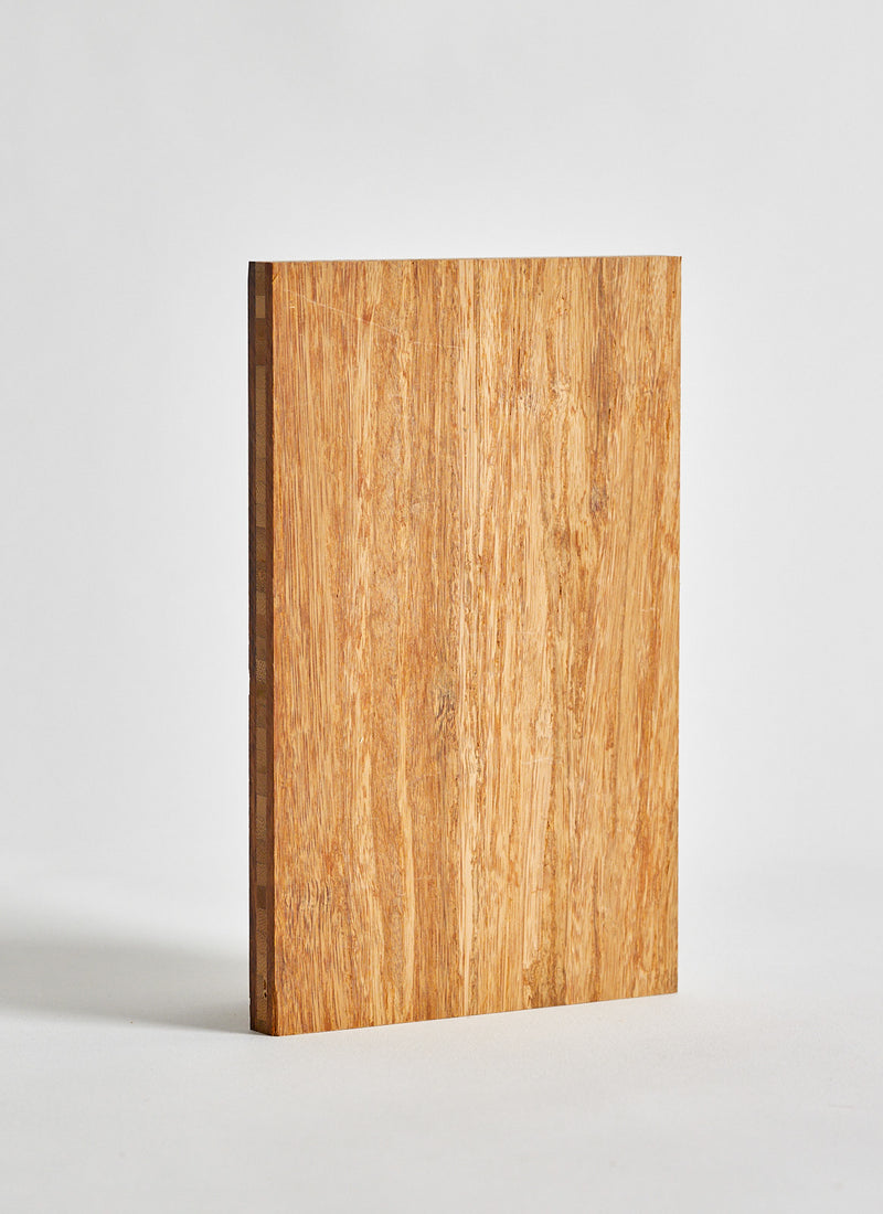 Plyco's Bamboo Strand Woven Carbonised Plywood with a white background