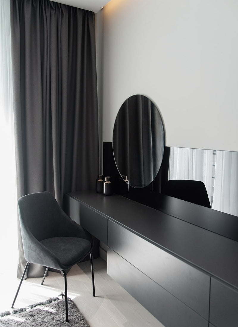 Melbourne plywood supplier Plyco's standard 18mm Black Melamine Particleboard used as cabinetry in a bedroom vanity project from with a white background
