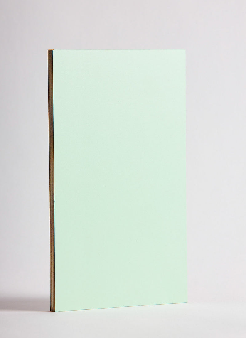 Plyco's Mint Decor Laminate pressed onto a Birch Plywood core (Decoply) on a white background