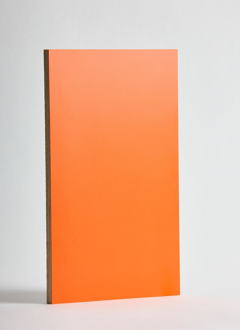 Plyco's Orange Decor Laminate pressed onto a Birch Plywood core (Decoply) on a white background