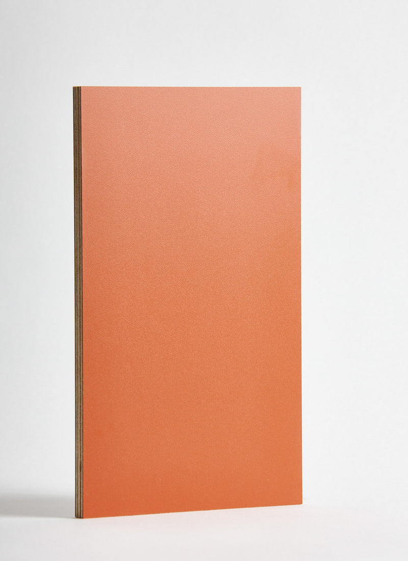Plyco's Rust Decor Laminate pressed onto a Birch Plywood core (Decoply) on a white background