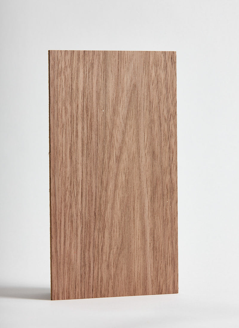 Plyco's American Walnut Micropanel laser cutting MDF on a white background