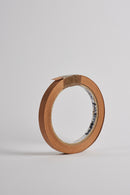 Plyco's 50m x 22mm pre-glued American Cherry Veneered Edging on a white background